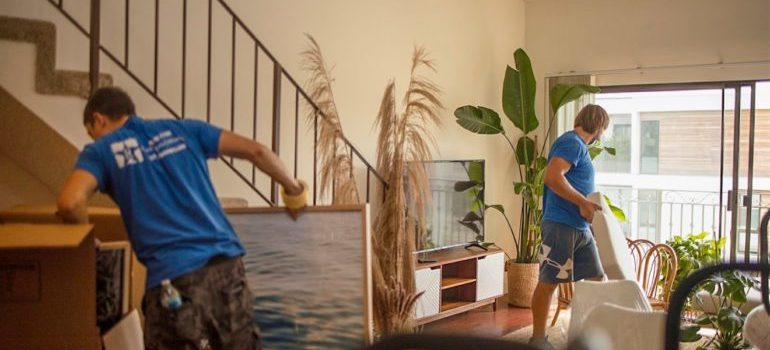 mover packing things in living room 