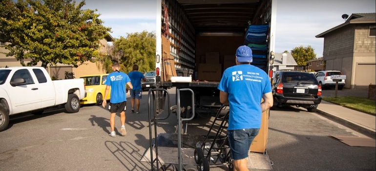 Movers around a moving truck