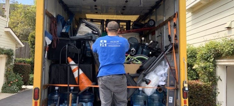 Mover securing items in a moving truck 