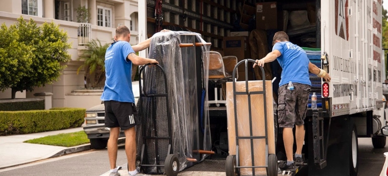 Piano movers Dallas–Fort Worth metroplex loading up a piano in a truck