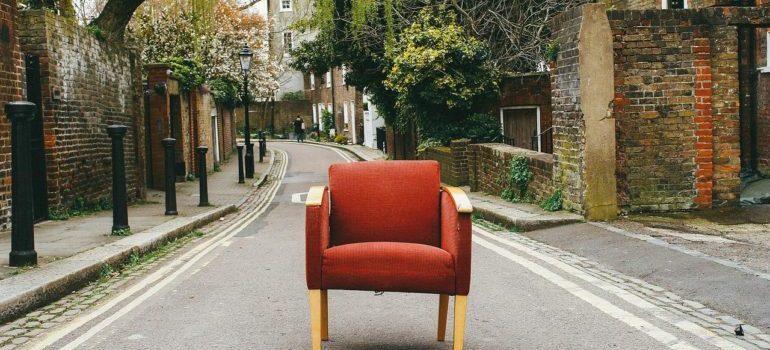 a sofa in the middle of a street.