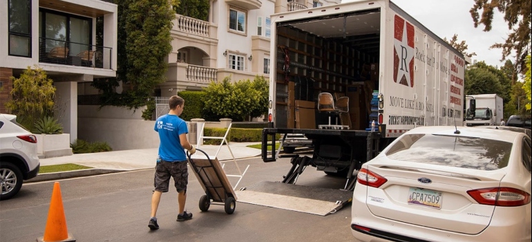 One of Houston movers loading a moving truck