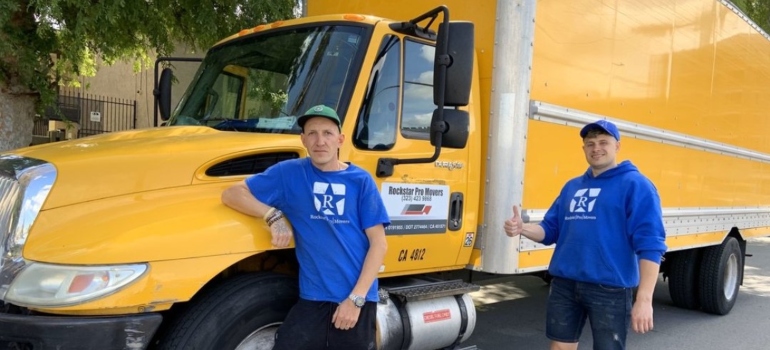 Movers next to a truck