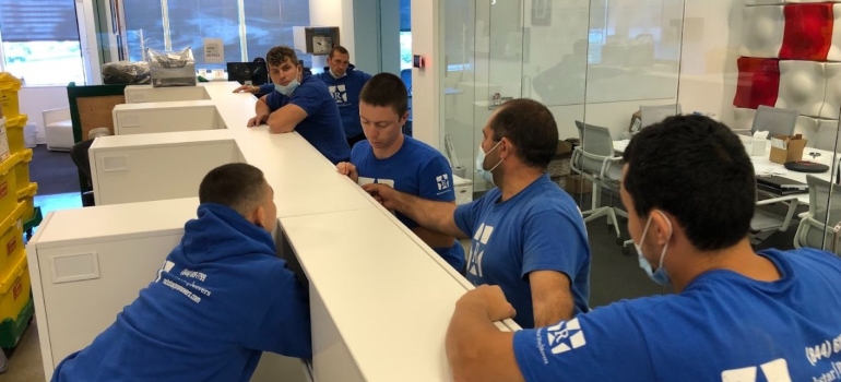 Commercial movers Houston packing an office
