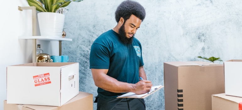 a mover looking at a piece of paper