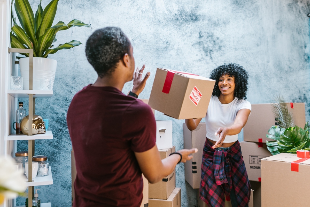 smiling couple having fun while moving