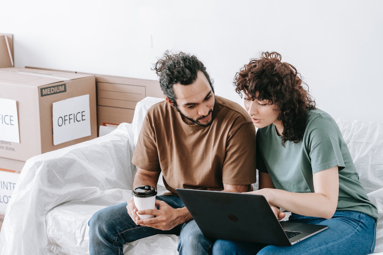 A couple using a laptop