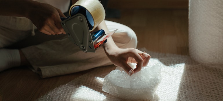 Person packing an item