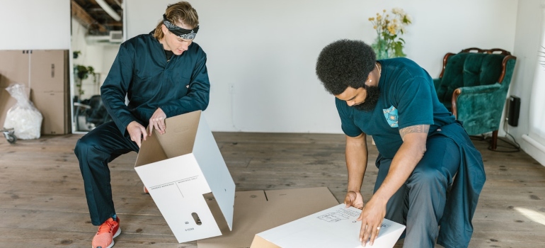 Movers packing boxes