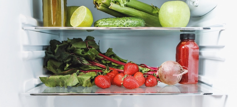 various fruits and vegetables, as well as their juices in the refrigerator to depict one of the things you should leave behind when leaving Las Vegas