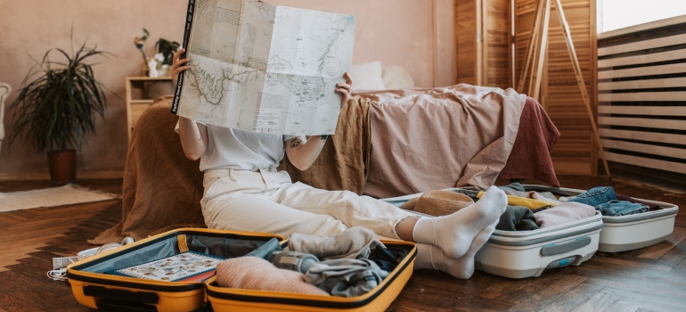 Girl packing suitcases