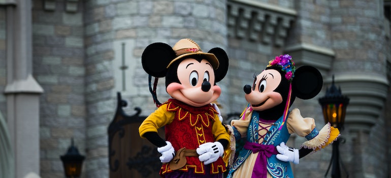 Two people in costume of Mickey and Minnie mouse posing while thinking about 10 best live music venues in Dallas–Fort Worth metroplex;