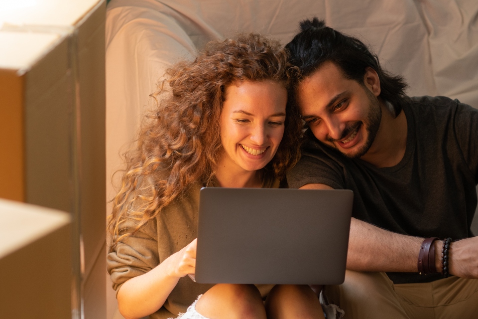 couple looking at their laptop