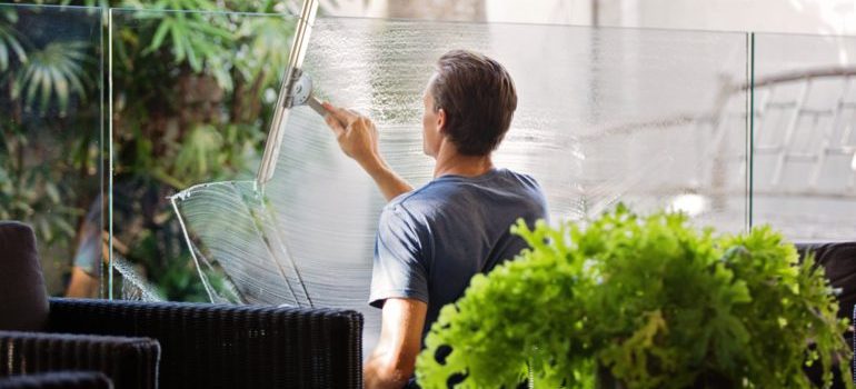 Man cleaning a window