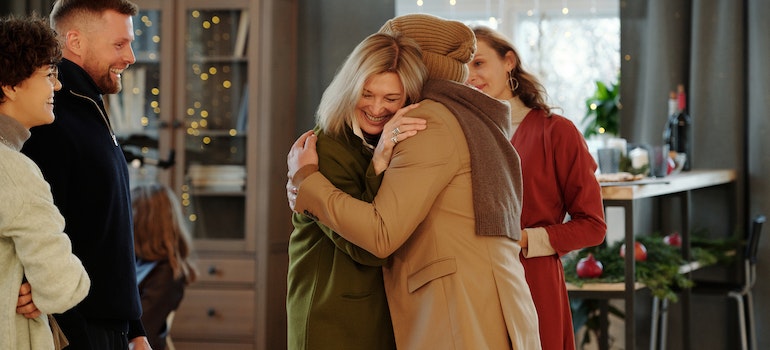 Woman hugging and asking for help to protect her furniture during a move