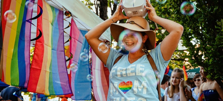 A woman and LGBT flags