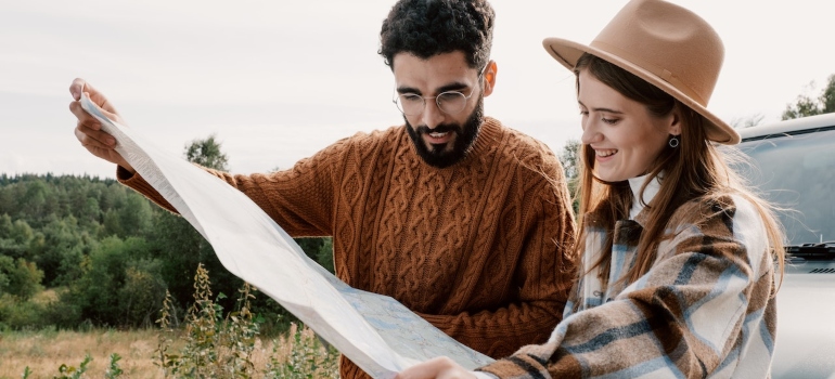 young adults looking at a map