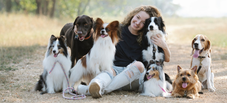 Girl and dogs in the park ready for living in Austin with a dog