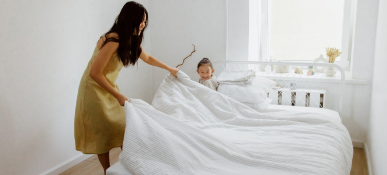 Mother and daughter cleaning home in LA