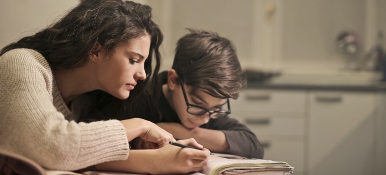 Picture of an adults and a kid studying the benefits of living in the San Fernando Valley