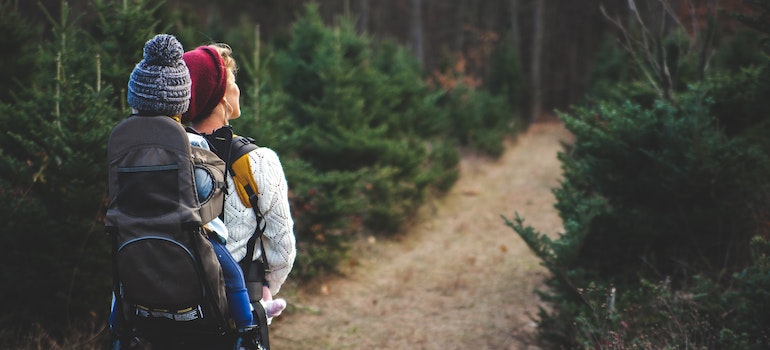 a mother hiking with her child