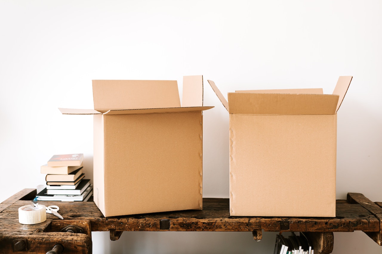 Two moving boxes sitting on a desk