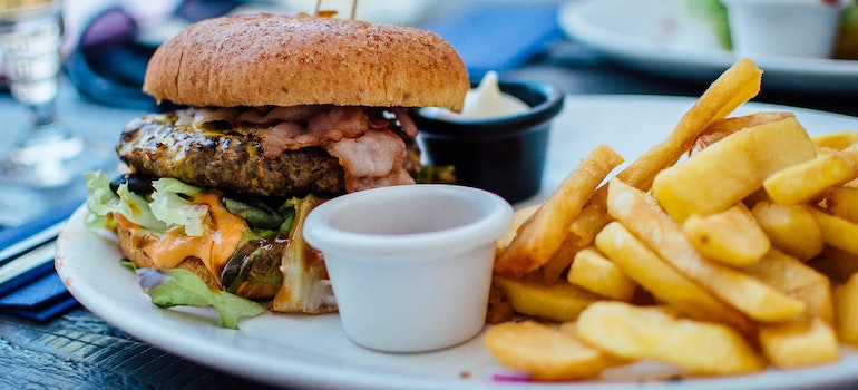 a burger and fries on a plate