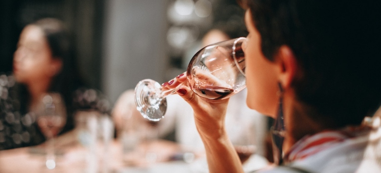 Picture of a woman enjoying wine in one of the best wineries in Napa Valley